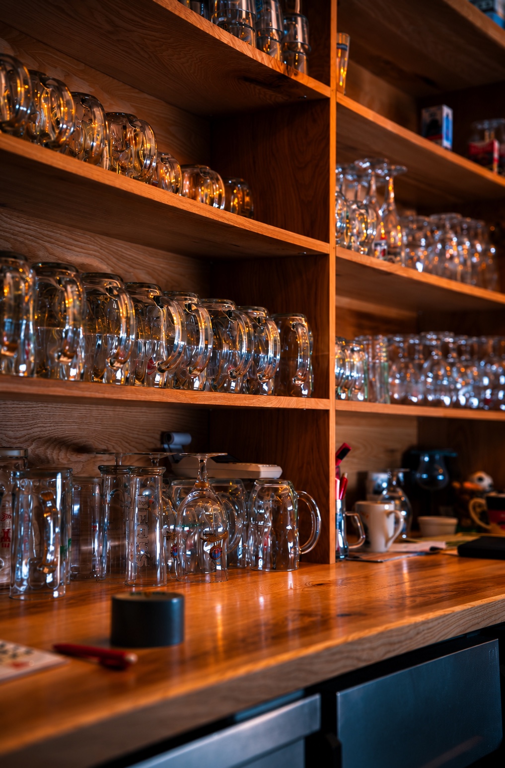 Moody amber-teal bar shelf and craft cocktail counter at SaDem Events